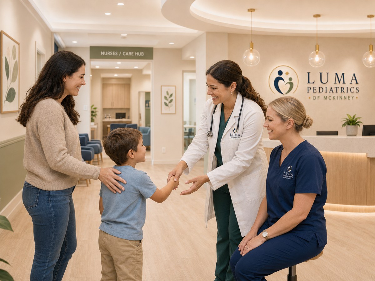 A pediatrician meeting a child and parent at eye level in a calm exam room